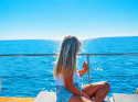 Excursión en barco a la Cala Blanca con comida, baño y moto de agua desde Jávea