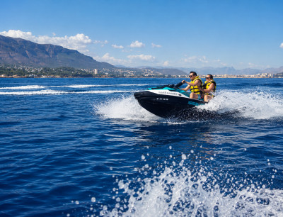 Boat trip to Cala Blanca with lunch, swimming, and jet skiing from Jávea